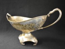 An impressive 20th century silver plated basket, of oval form having a moulded rim, floral scroll