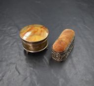 A George V silver powder pot, of circular form having a faux tortoiseshell lid, raised on three