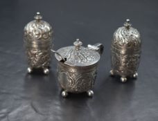 A Victorian silver three piece cruet set, comprising mustard, salt and pepper, of cylindrical form