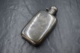 A George V silver hip flask, of tall rectangular form slightly curved for the pocket, marks for
