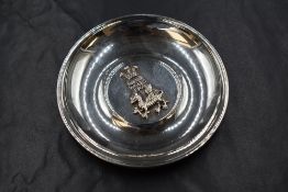 An Elizabeth II silver trinket dish, having the Welsh dragon and Welsh Prince of Wales's feathers to