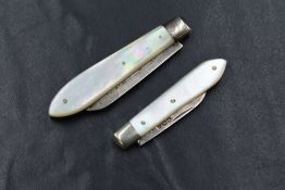A late Edwardian silver and mother-of-pearl fruit knife, the serrated silver blade within a mother-