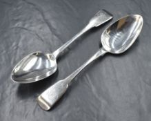 A pair of George IV silver fiddle pattern serving spoons, having 'HR' monograms to terminals,