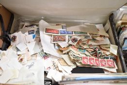 A box of assorted world and GB stamps and first day covers etc.
