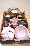 An early 19th century pink splash lustre jug and matching sugar bowl, six copper lustre jugs and a