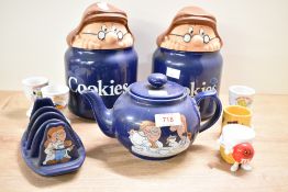 A pair of vintage Tetley tea storage jars labelled 'Cookies' sold alongside a Tetley tea teapot