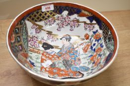 A 20th-century Chinese porcelain charger, featuring two central figures in traditional attire within