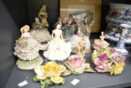 A selection of assorted figurines including Capodimonter and Fabris porcelain lace figurines etc.