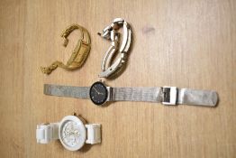 Four ladies fashion quartz wrist watches including Skagen, Fossil, Swarovski and Guess, non