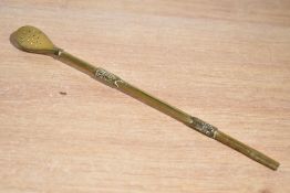 A 20th-century South American gilded metal bombilla, a filtered straw used for drinking Yerba Mate