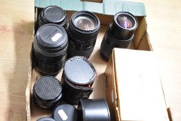 A collection of lenses. A boxed Sigma 70-30mm 1:4-5,6 DL Macro Super, a Sigma UC Zoom 70-200mm 1:4-
