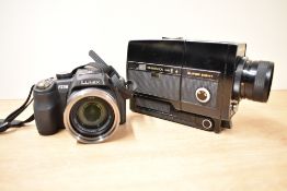 A Lumix Panasonic DMC-FZ38 digital camera and a Suwanica Mark IV super eight camera in hard case