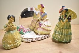 Three 20th-century porcelain figurines to include, a Royal Doulton-style porcelain figurine with a