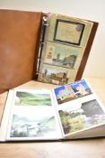 Two 20th-century postcard albums, including one titled 'Wales' and the other untitled but containing