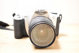 A Canon EOS300 camera with Canon Zoom EF 28-105mm 1:4-5,5 lens in soft camera bag