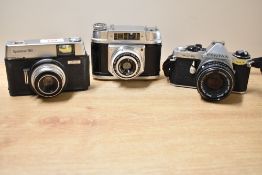 Three cameras. A Pentas ME Super with Pentax-M 1:1,7 50mm lens, an Ilford Sportsman 300, and a