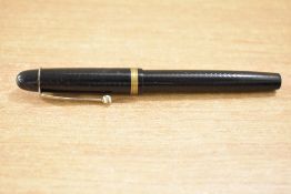 A High Class lever fill fountain pen waved Black with lined cap band having an ABC Gold Plated nib