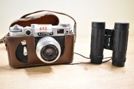 A Zorki-6 camera with an Industar - 50 lens in a leather selling with a pair of DF-8210 8x21