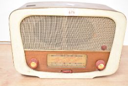 A vintage Pye P117 'Piper' AM/FM valve radio, featuring a bakelite case, 30cm x 20cm, condition is