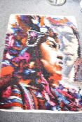 A vintage blanket or hanging in fleece which depicts a portrait of two First Nations people or