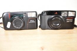Two compact cameras. A Nikon TW Zoom 35-70 and Pentax Zoom 70-X