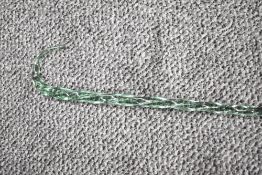 A Nailsea style twisted glass walking stick measuring 106cm long