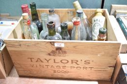 A collection of fourteen 20th-century bottles, including, for example, Jonas Alexander & Sons of