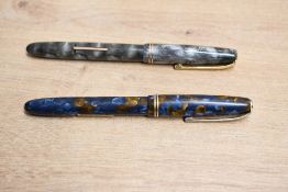 Two Burnham No54 lever fill fountain pens one in Blue and Gold, the other in Grey both with two