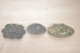 Three vintage American Western brass belt buckles, to feature a large A.J Dezy company 'Big Sky