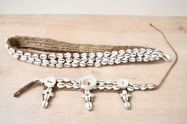 Of ethnographic interest, two early to mid 20th-century Papua New Guinea hand woven cowrie shell