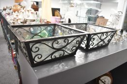 Two large 20th-century decorative metal light fittings/shades, having removable glass inserts