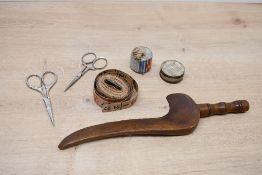 A late 19th century carved and turned mahogany goose wing knitting stick, 26cm sold together with