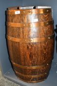 A large late 19th to early 20th-century oak coopered barrel umbrella/stick stand, having