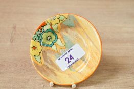 A small early 20th-century Art Deco Clarice Cliff 'Bizarre' Jonquil pottery plate, featuring a