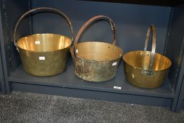 Three large late 19th to early 20th-century brass preserving pans, of graduated sizes, unmarked, (