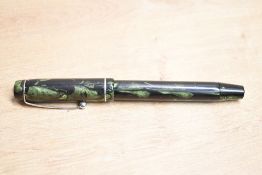 A Mentmore button fill fountain pen in Green and Black marble