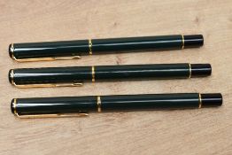 A Parker Rialto converter fill fountain pen and two Rollerball pens in Laque Dark Green