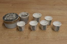 A Victorian iron stone advertising pot for 'cold cream', featuring a monochrome gothic-style