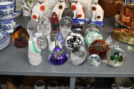 A collection of twenty mixed glass paperweights, to include Caithness Golden Jubilee Royal Cypher