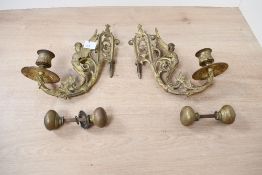 A pair of 19th-century French-style brass wall scone, featuring a winged caryatid figure with