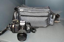 A Nikon F-301 SLR 35mm camera with Toki na SZ-X 80-200mm 1:4,5-5,6 lens and Sigma Zoom Master 1:2,