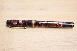 A Conway Stewart 56 lever fill fountain pen in Black and Pink with one broad and two narrow cap
