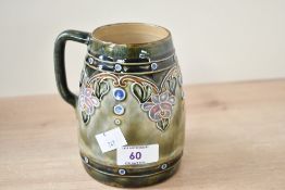 An early 20th-century Doulton Lambeth Art Nouveau-style stoneware jug, after Olive Dale (senior