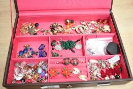 A Stackers jewellery box, containing an assortment of costume earrings, including faux pearls, paste