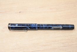 A Conway Stewart 336 lever fill fountain pen in black and blue mottled with bandless cap having