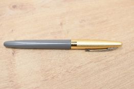 A Conway 106 aero fill in Grey with gold coloured cap