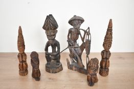 A selection of six 20th-century wood-carved African art sculptures, featuring stylised headdresses