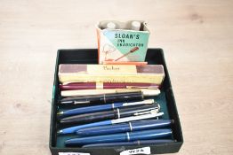 A selection of fountain pens, ballpoint pen and pencil. A Boxed Parker Duofold in grey, Parker