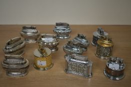 A quantity of 20th-century metal table lighters, to include three Ronson 'Queen Anne' examples; a