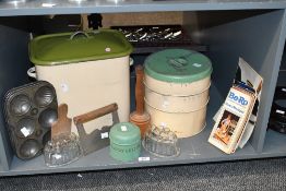 A large selection of vintage kitchenware, to feature a metal bread bin; a three tiered storage